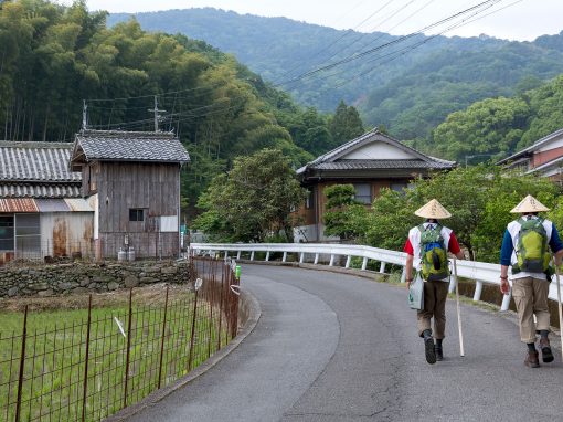 Two Shikoku pilgrims walking in the countryside